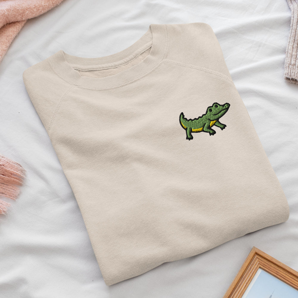 a t - shirt with a picture of a crocodile on it