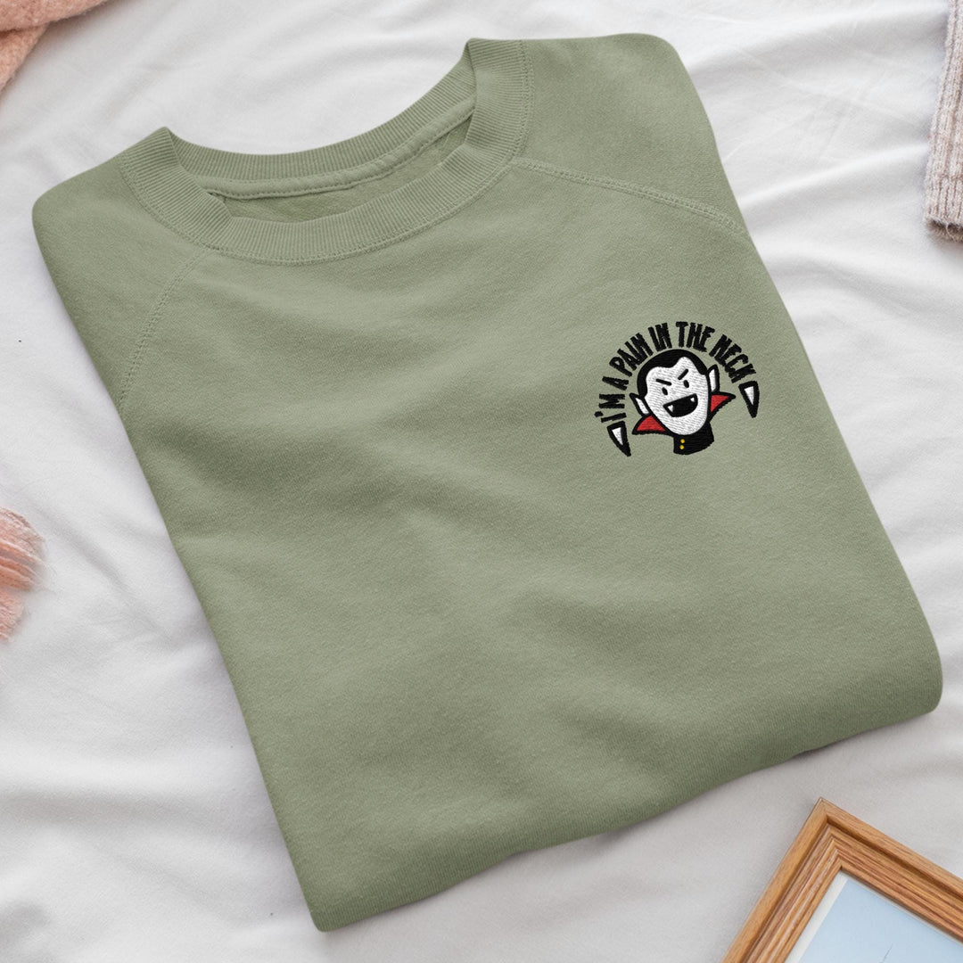 a green t - shirt with a clown face on it