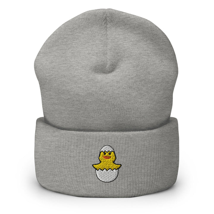 a gray beanie with a yellow chick on it