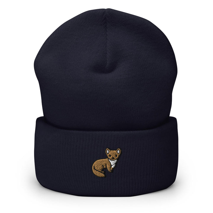 a blue beanie with a brown bear embroidered on it
