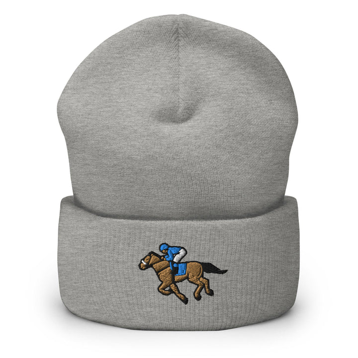 a gray beanie with a horse and jockey on it