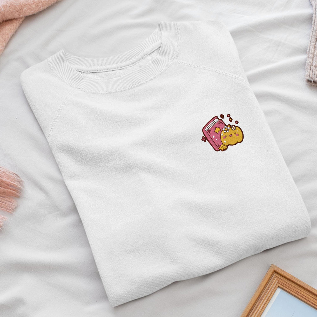 a white t - shirt with a cartoon character on it