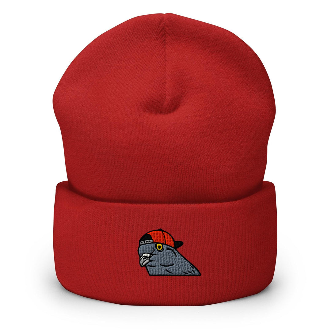 a red beanie with an image of a bird on it
