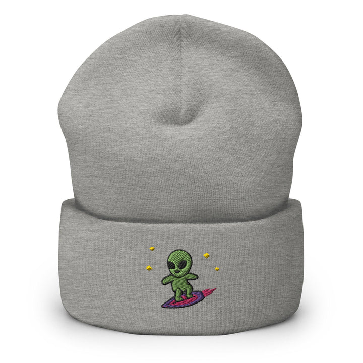a grey beanie with a green alien on it