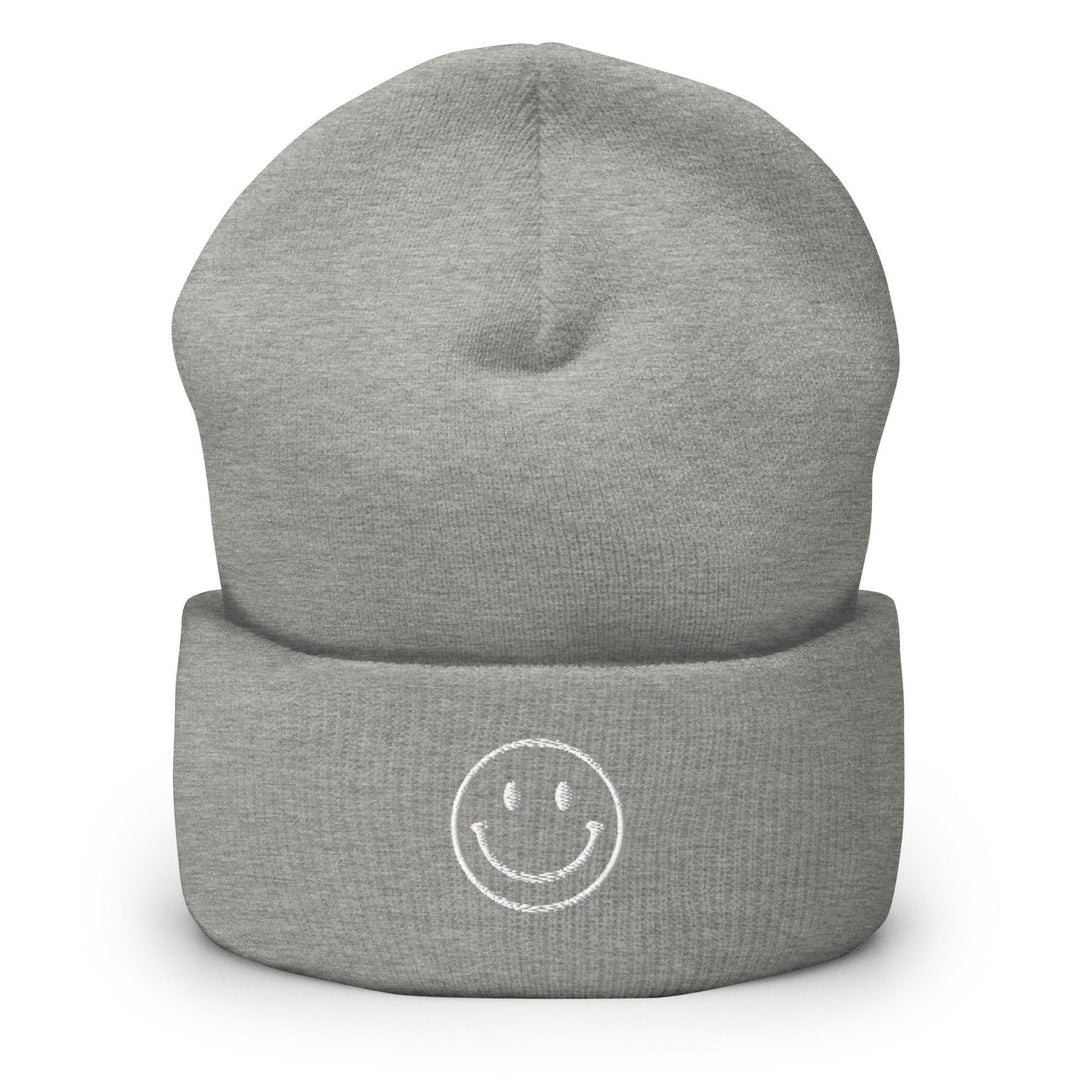 a grey hat with a smiley face on it