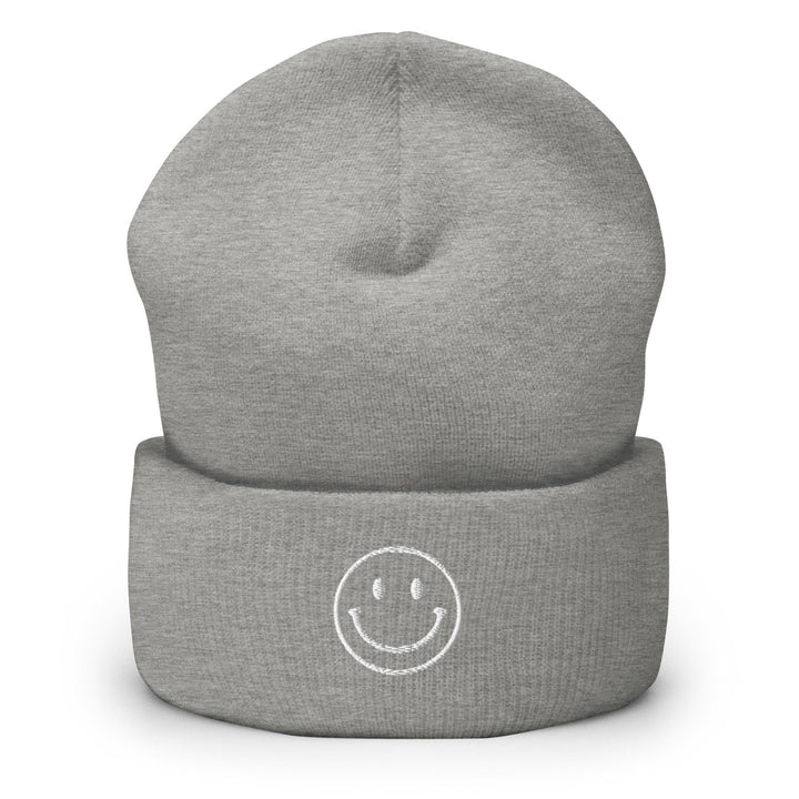 a grey hat with a smiley face on it