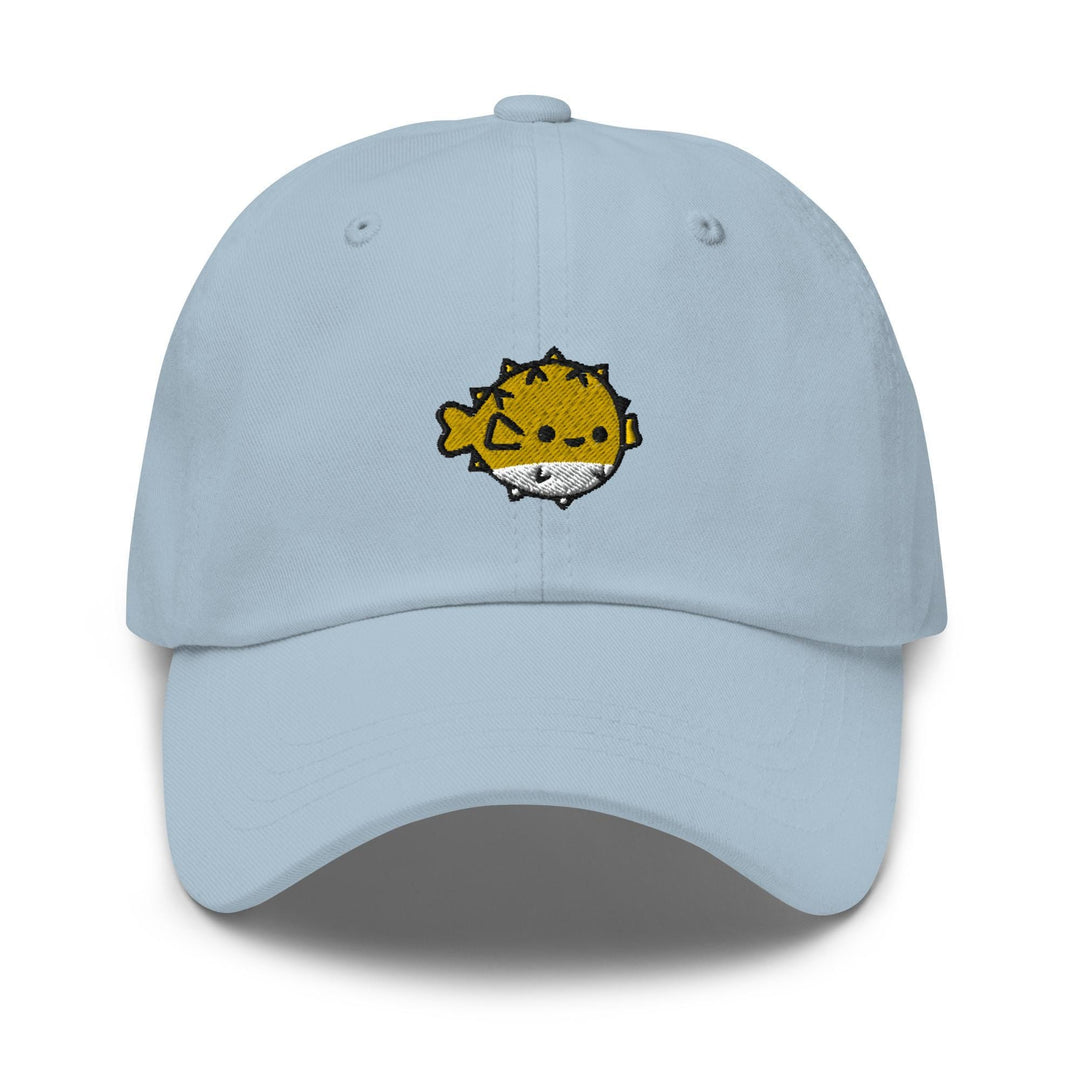 a light blue hat with a cartoon cat on it