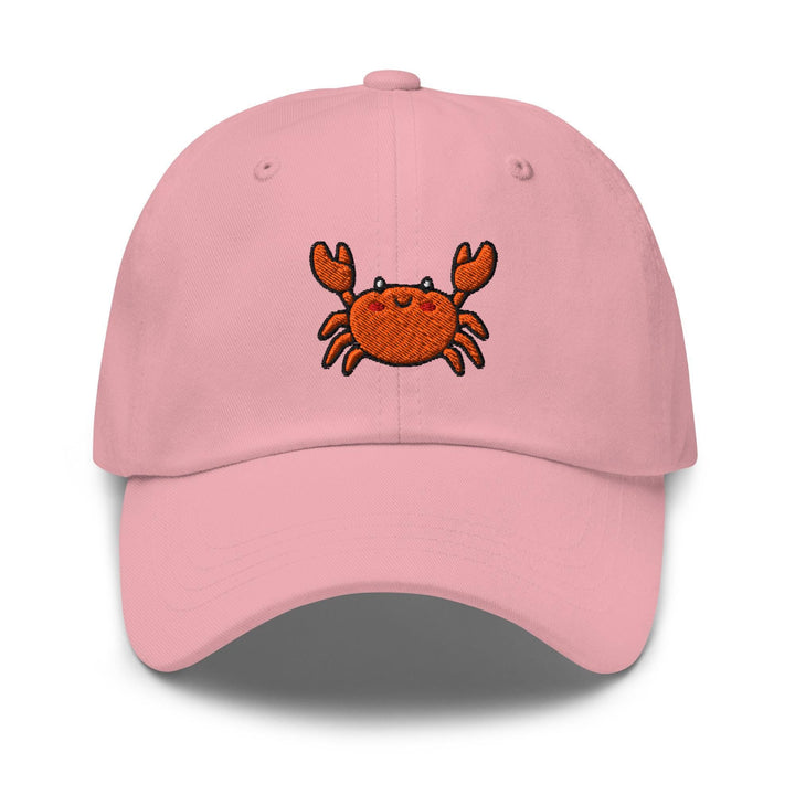 a pink hat with a crab embroidered on it