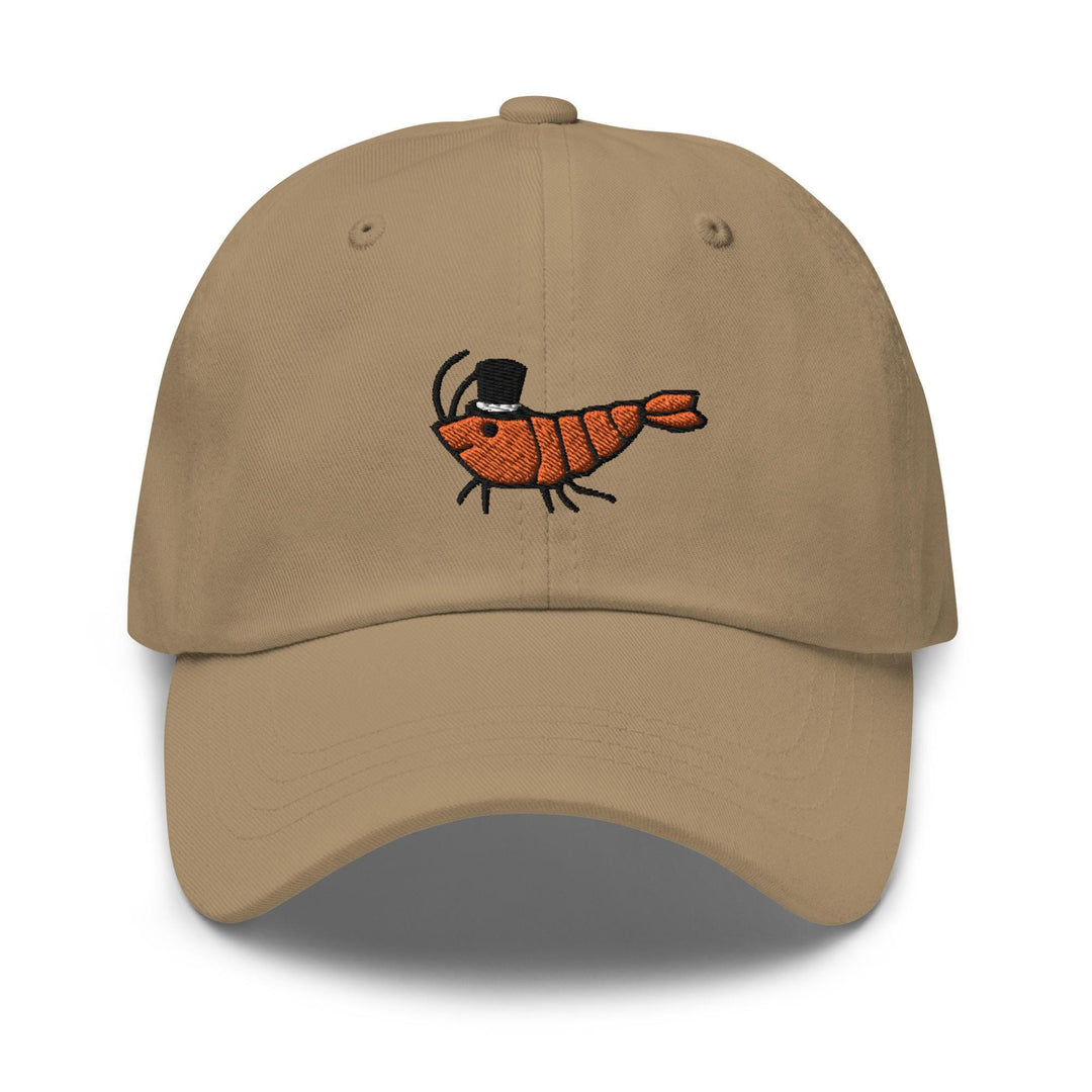 a tan baseball cap with a picture of a shrimp on it