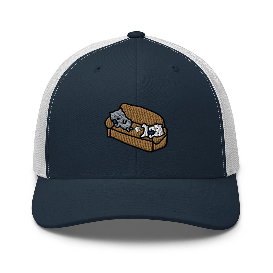 a blue and white trucker hat with an image of two cats on a couch