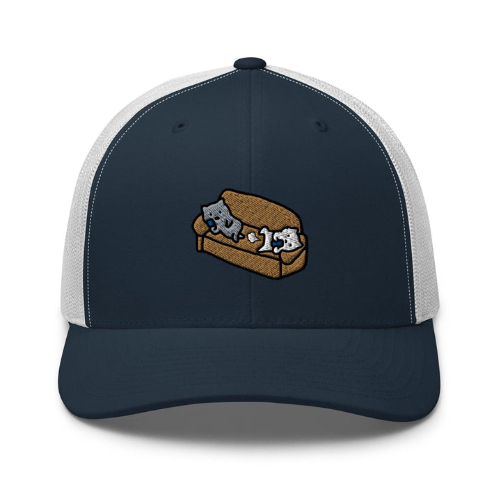 a blue and white trucker hat with an image of two cats on a couch