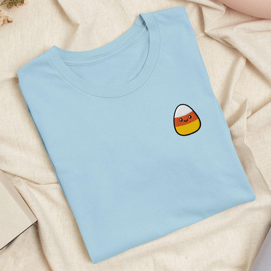 a blue t - shirt with a picture of an egg on it