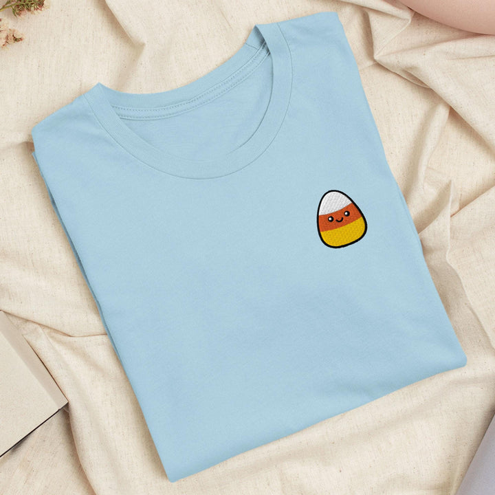 a blue t - shirt with a picture of an egg on it
