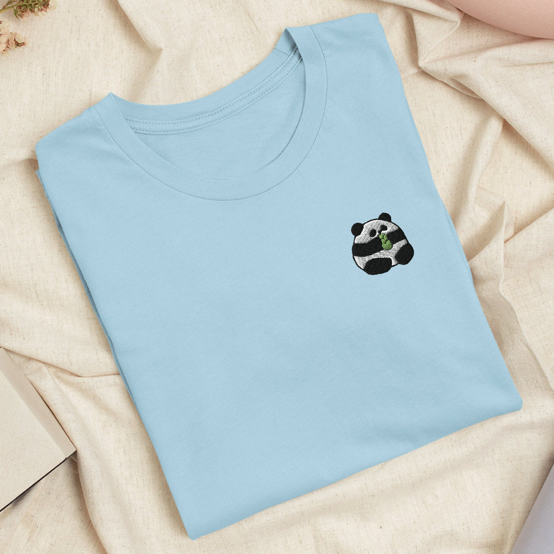 a blue t - shirt with a panda face on it