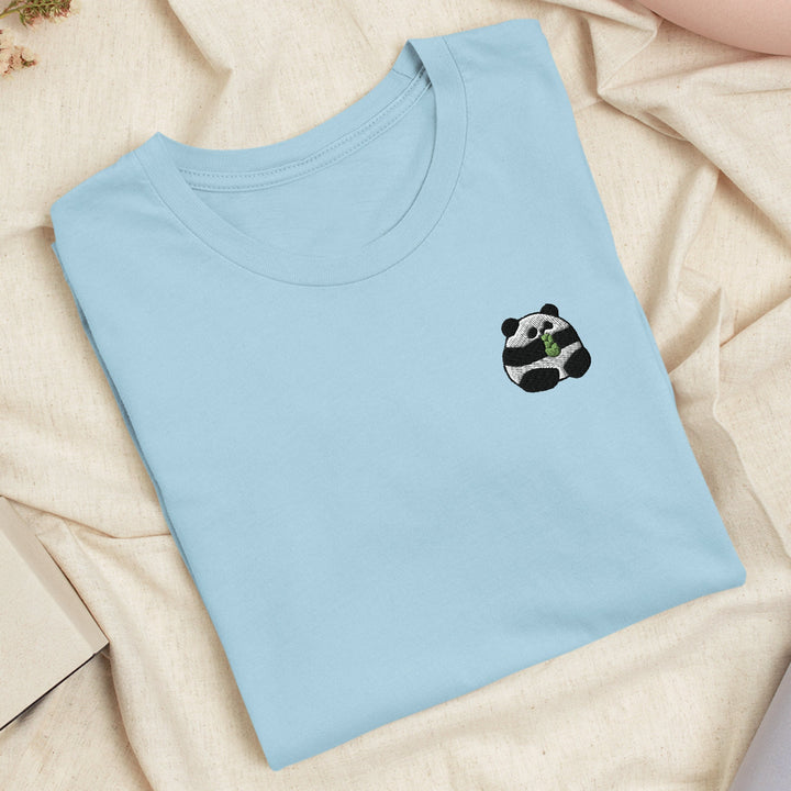a blue t - shirt with a panda face on it