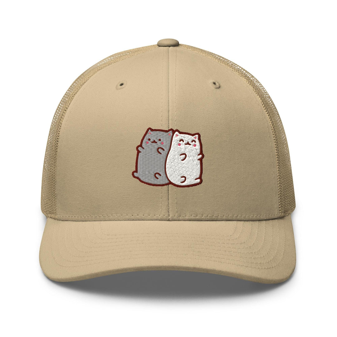 a tan trucker hat with two cats on it