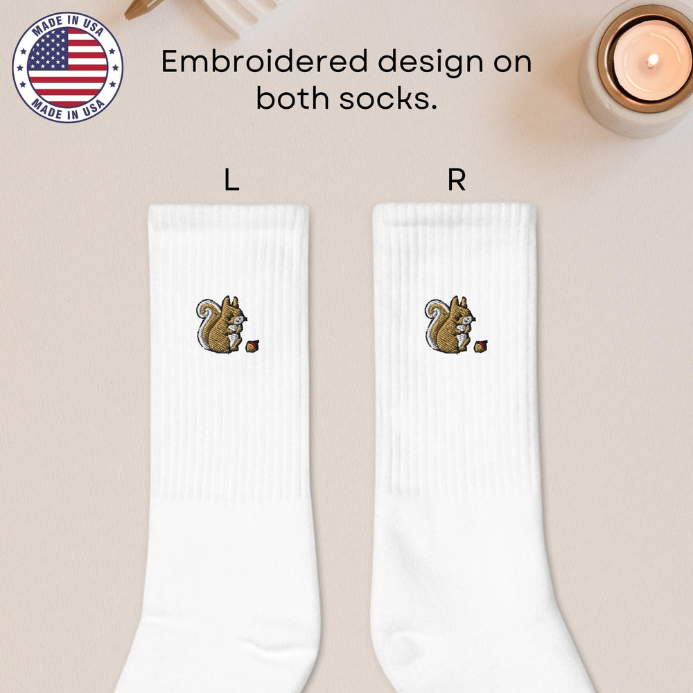 a pair of white socks with a squirrel on it