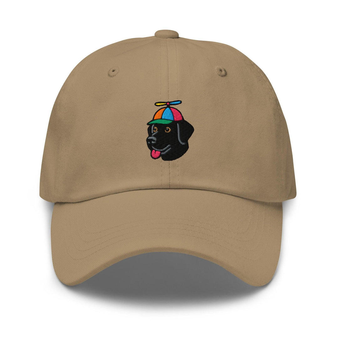 a tan hat with a black dog wearing an umbrella