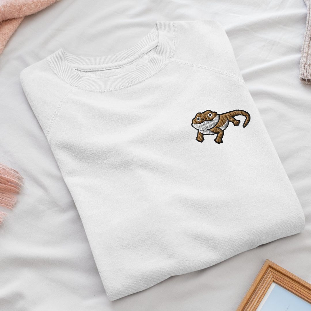 a white t - shirt with a monkey embroidered on it