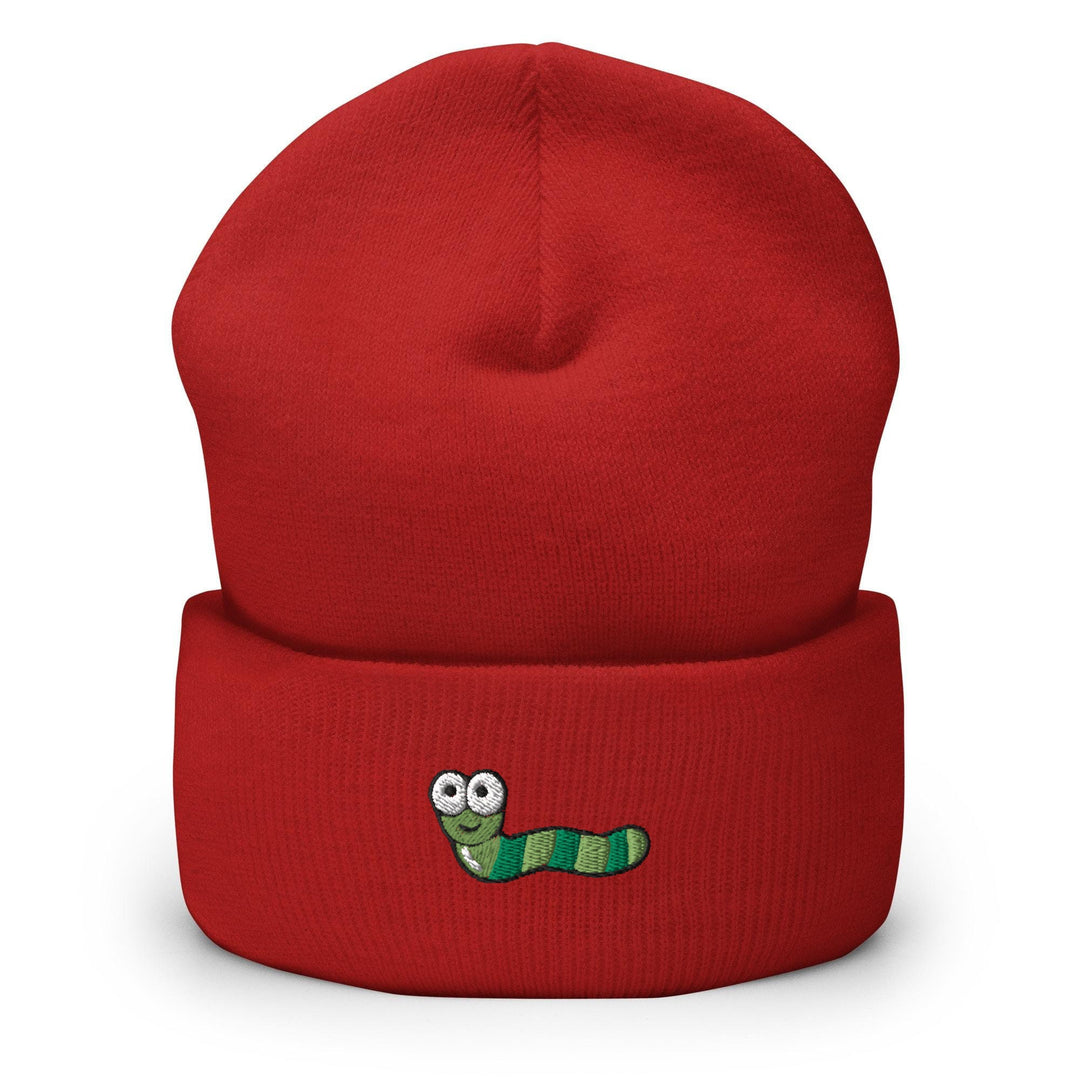 a red hat with a green caterpillar embroidered on it
