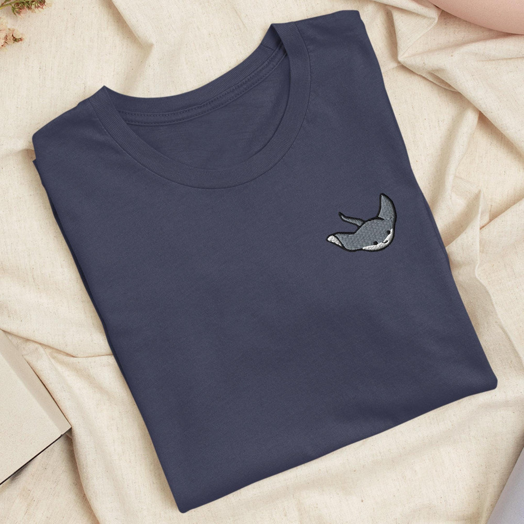a t - shirt with a picture of a shark on it