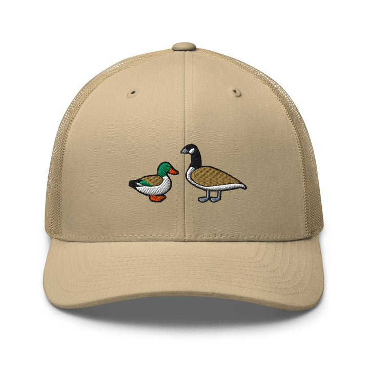 a tan trucker hat with two ducks on it