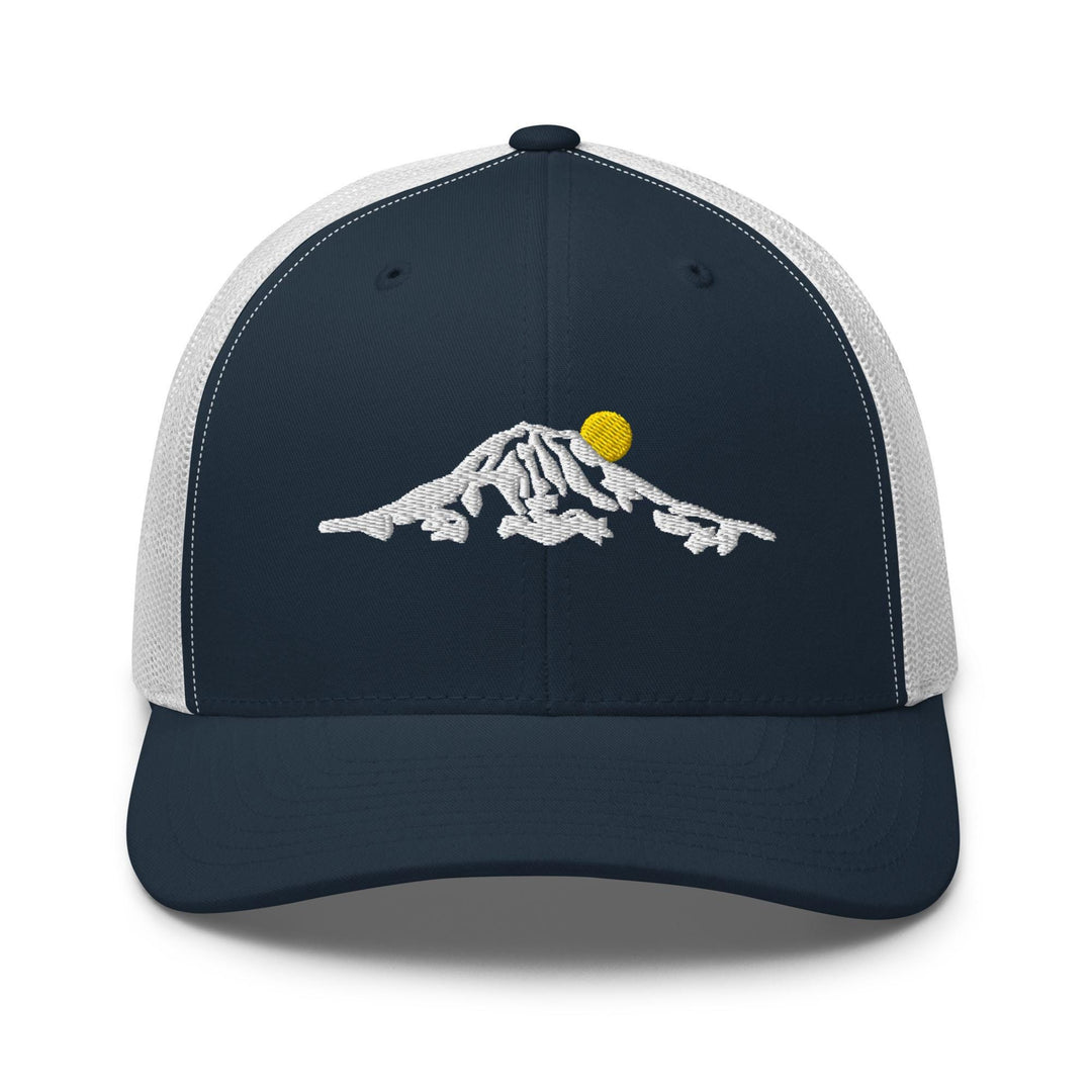 a blue and white trucker hat with a mountain design