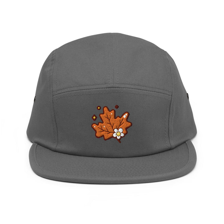 a gray hat with an embroidered maple on it
