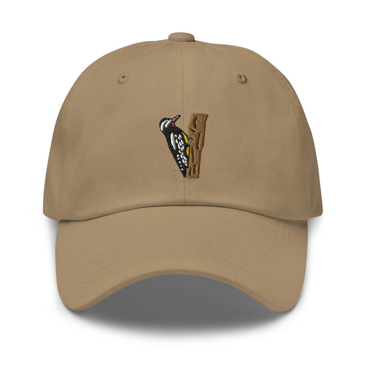 a tan hat with a bird on it