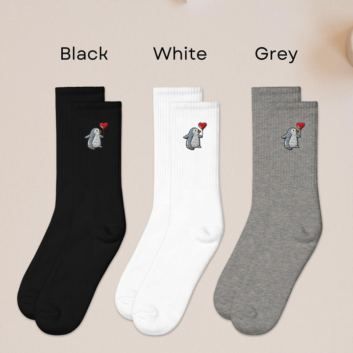 three pairs of black, white, and grey socks