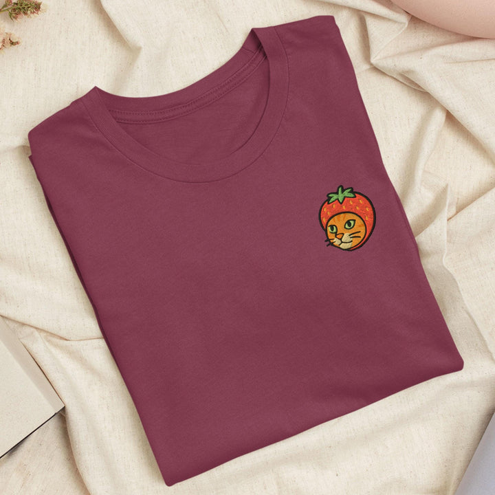 a t - shirt with a picture of a tomato on it