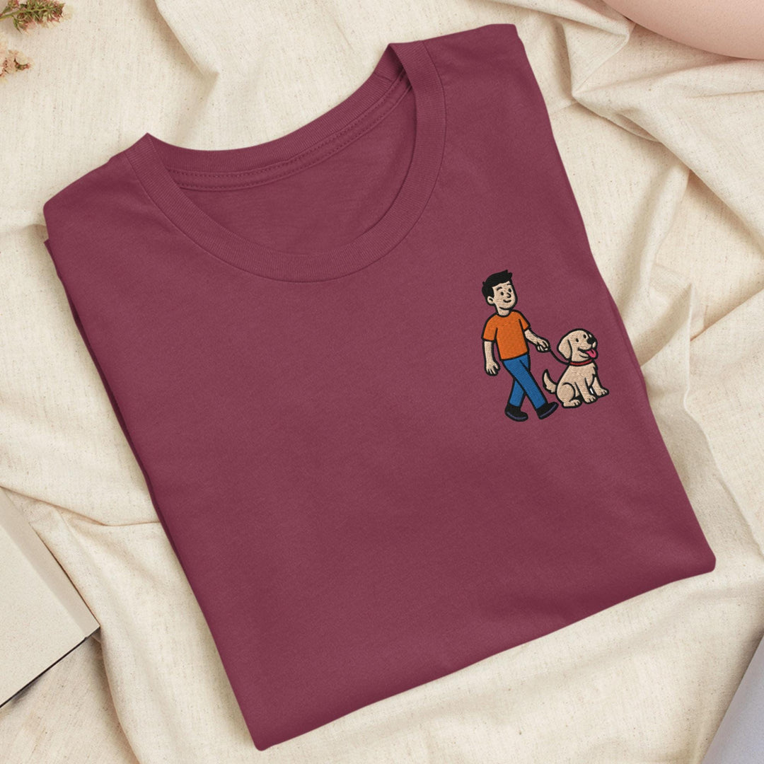 a red shirt with a picture of a man and a dog on it