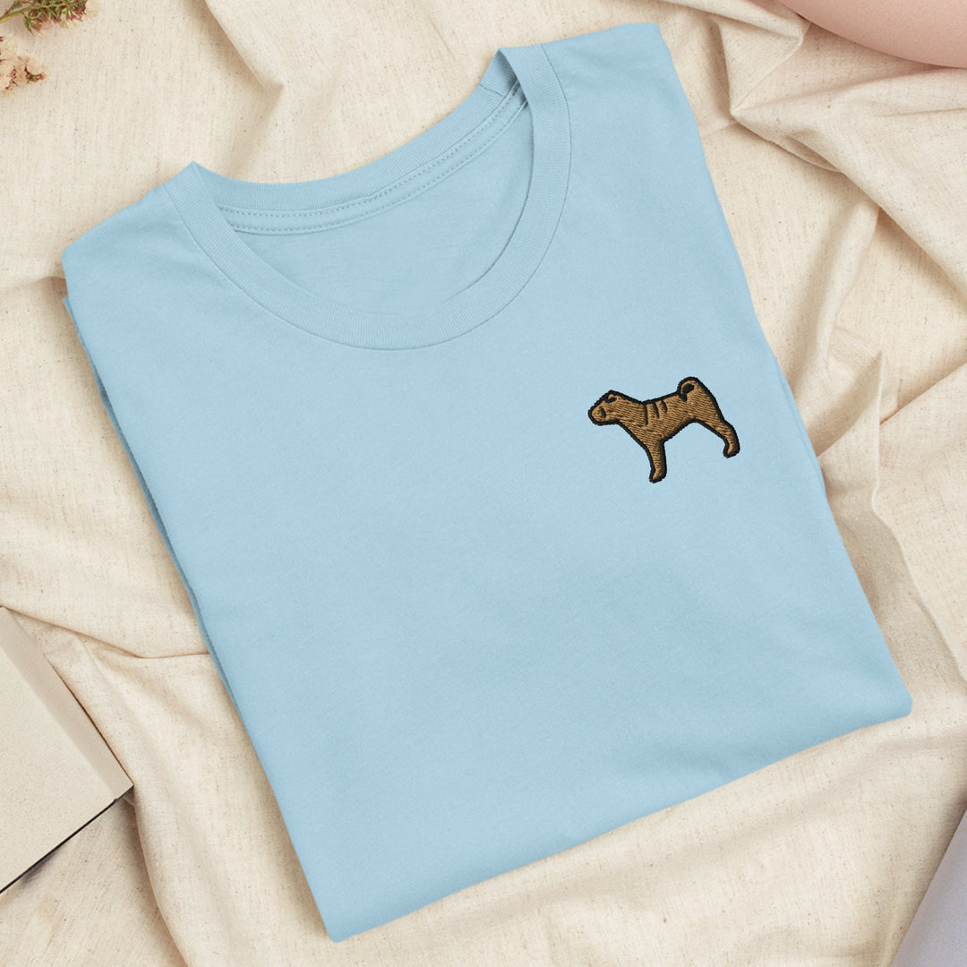 a blue t - shirt with a brown dog embroidered on it