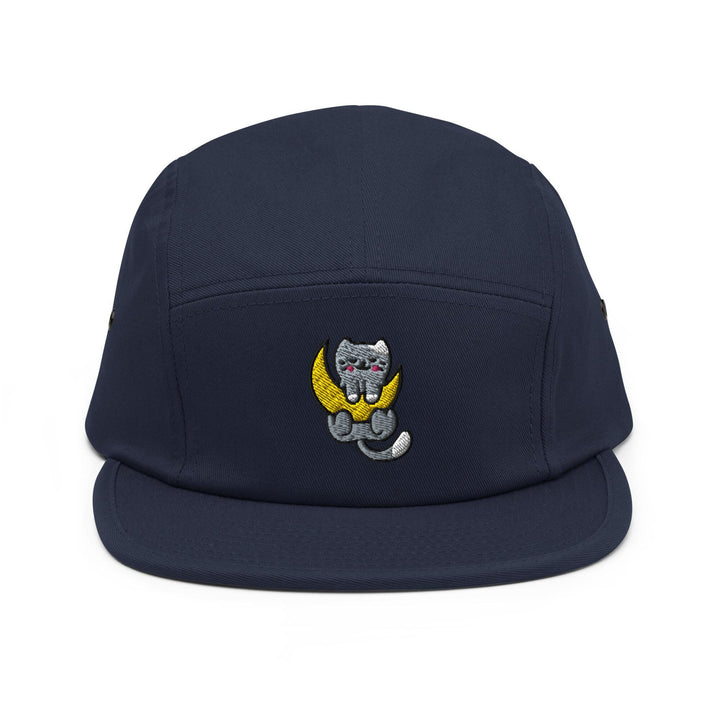 a blue hat with a cat sitting on the moon