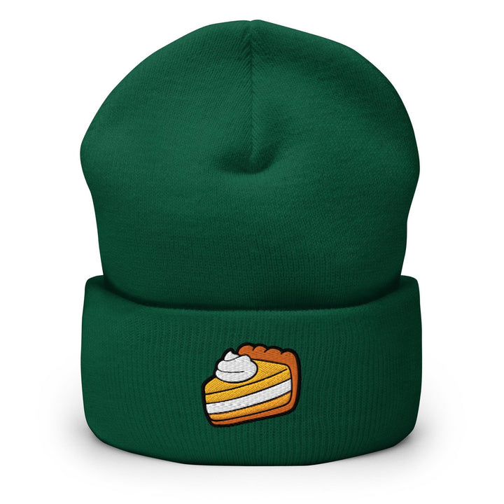 a green beanie with a piece of cake on it