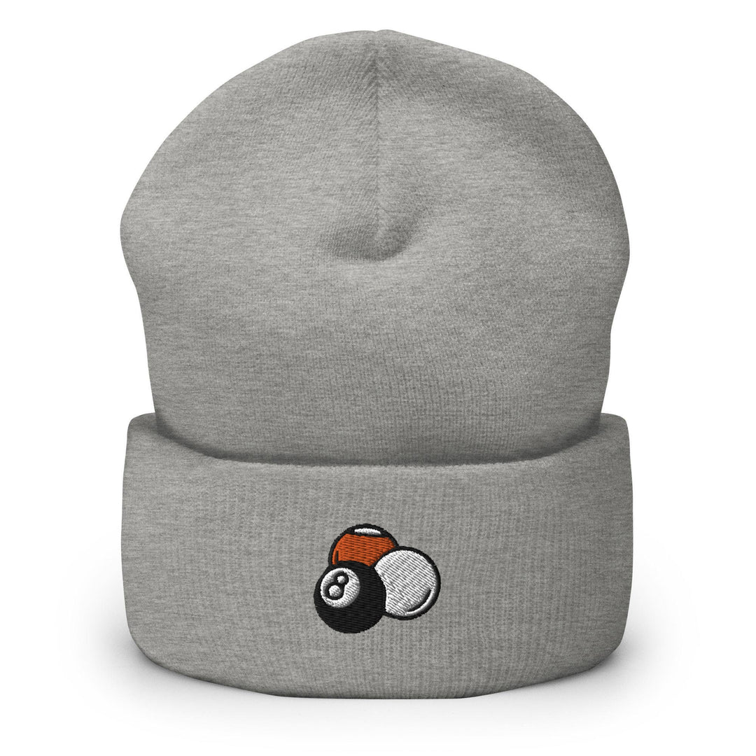 a grey beanie with an orange and white ball on it