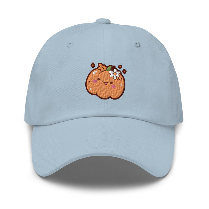 a light blue hat with a cartoon pumpkin on it