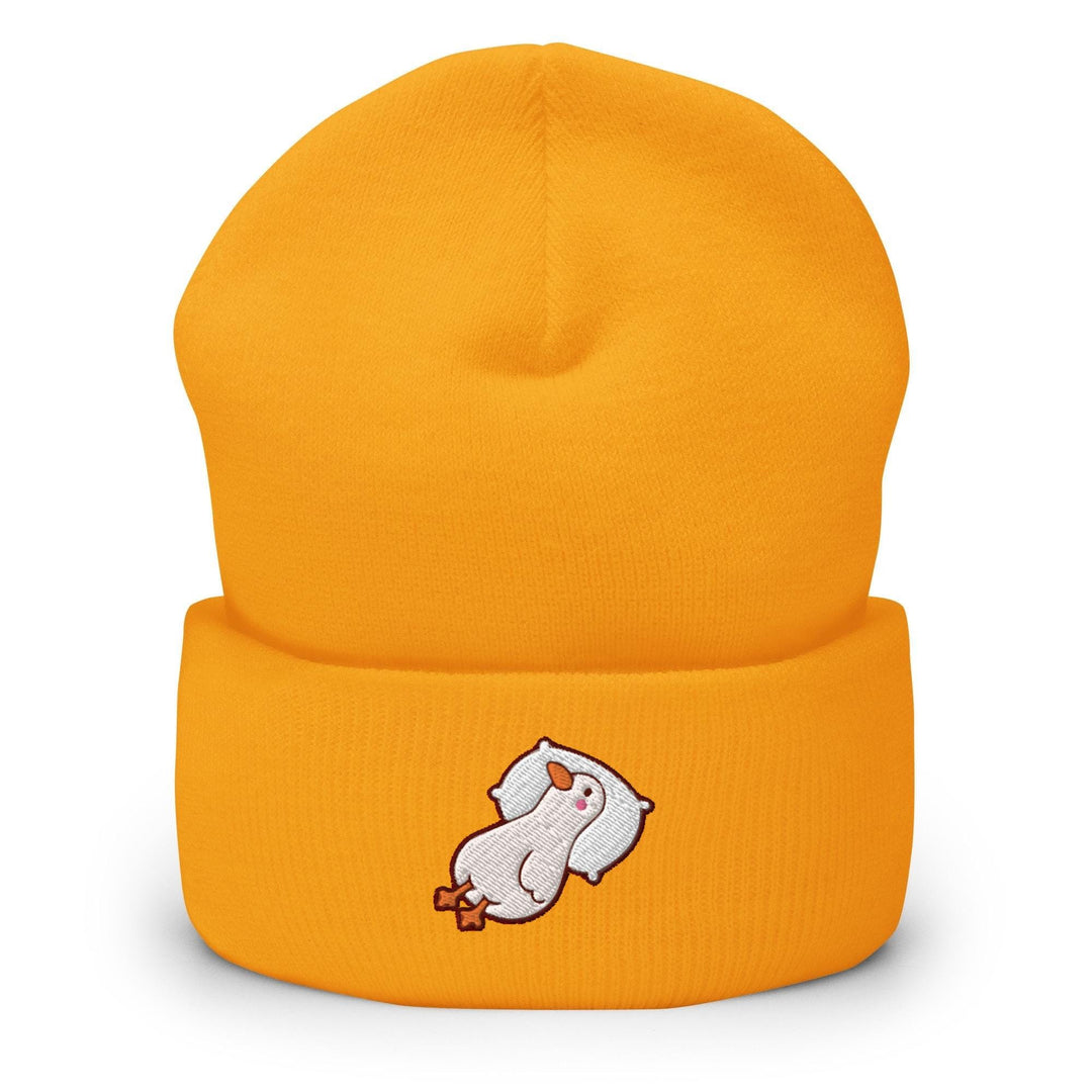 a yellow beanie with a white bear on it