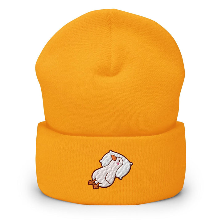 a yellow beanie with a white bear on it
