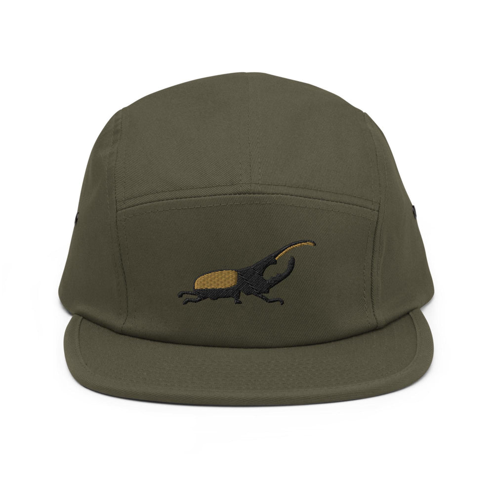 a green hat with a lizard embroidered on it