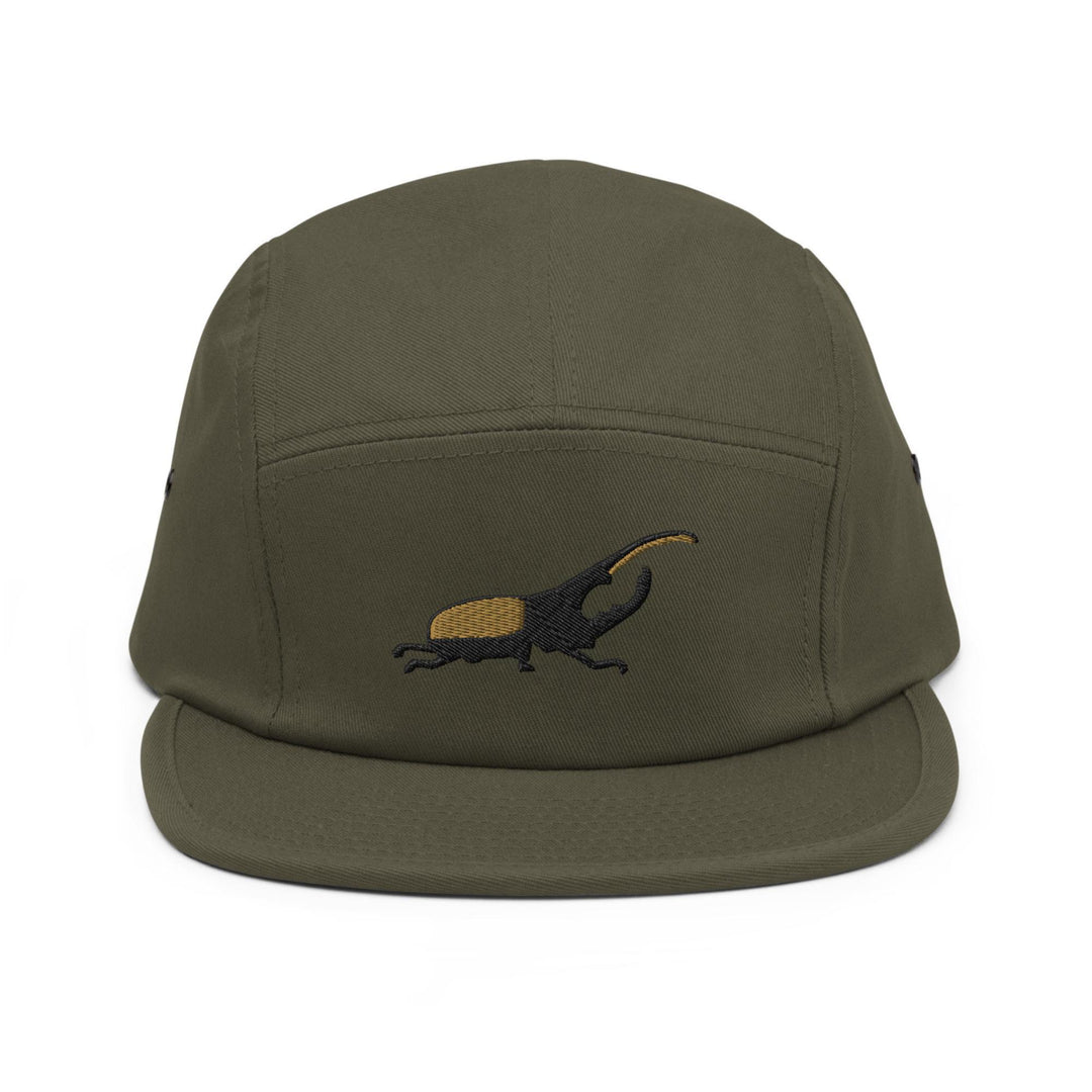 a green hat with a lizard embroidered on it