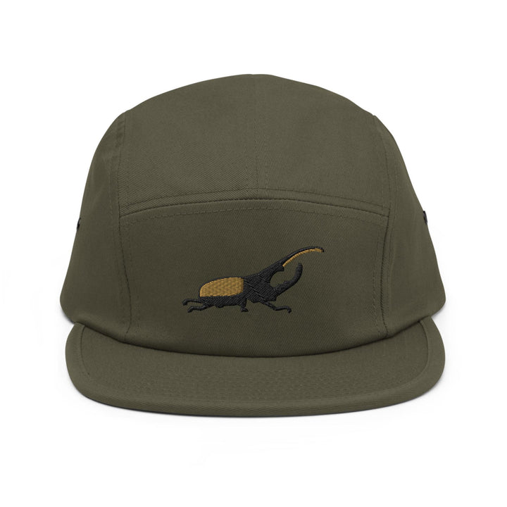 a green hat with a lizard embroidered on it