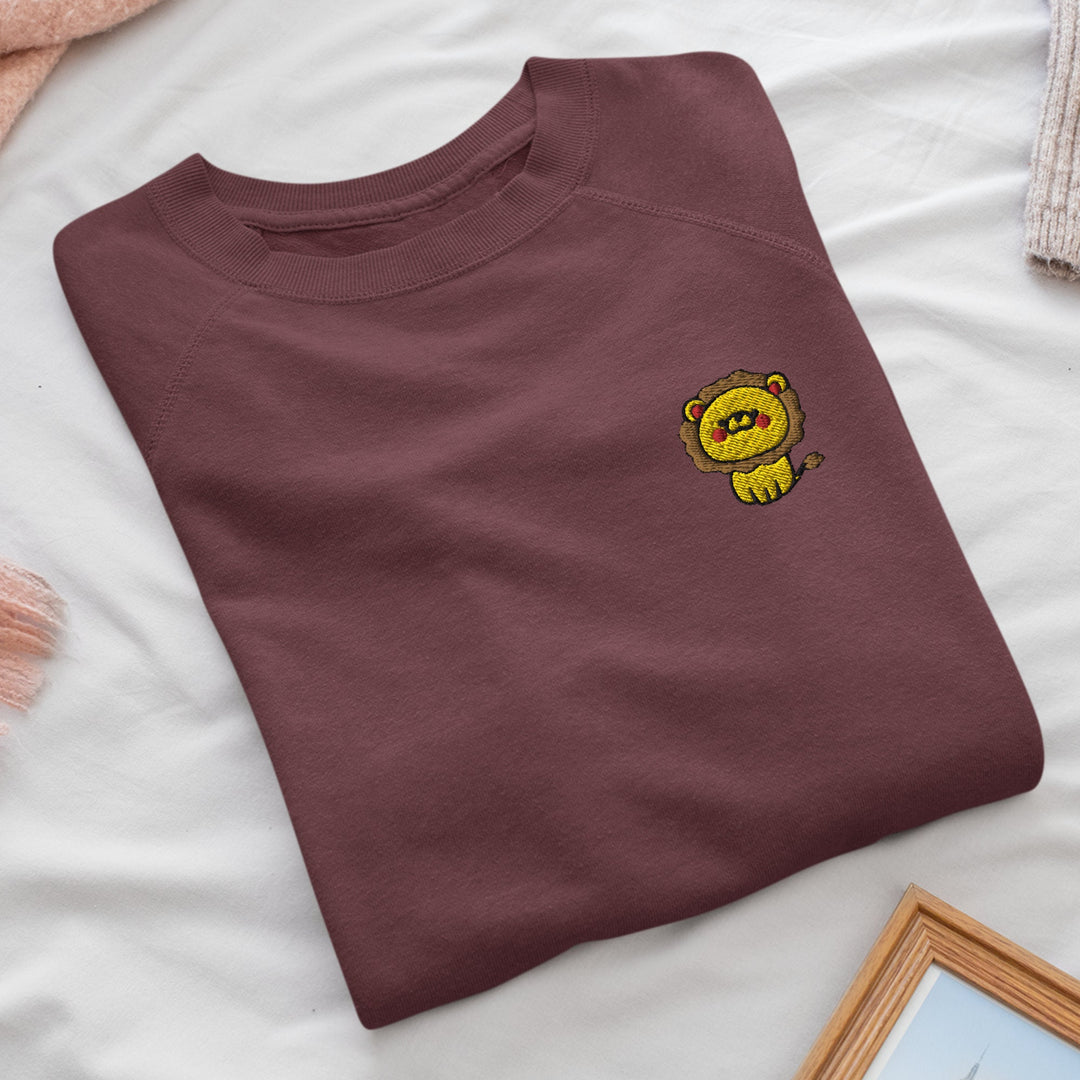 a brown t - shirt with a yellow bear on it