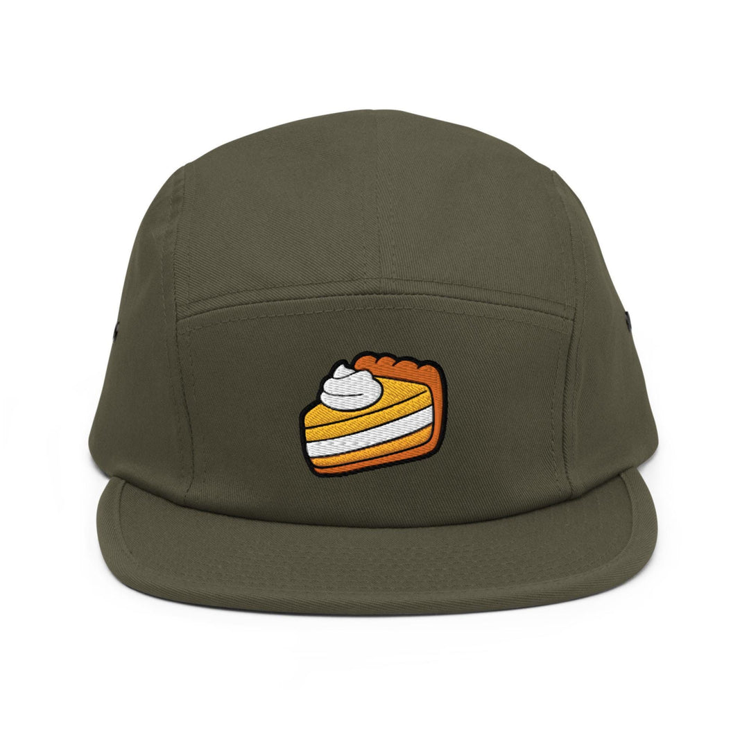 a green hat with a piece of cake on it
