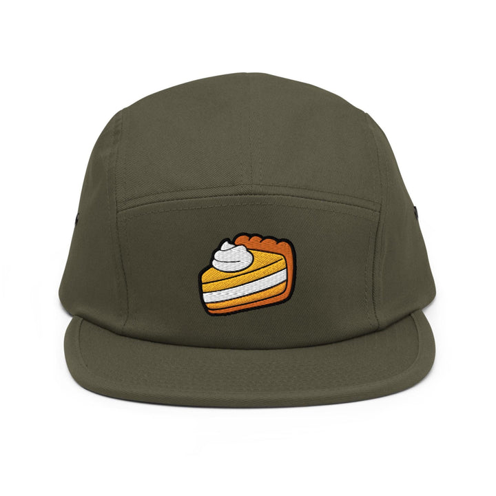 a green hat with a piece of cake on it