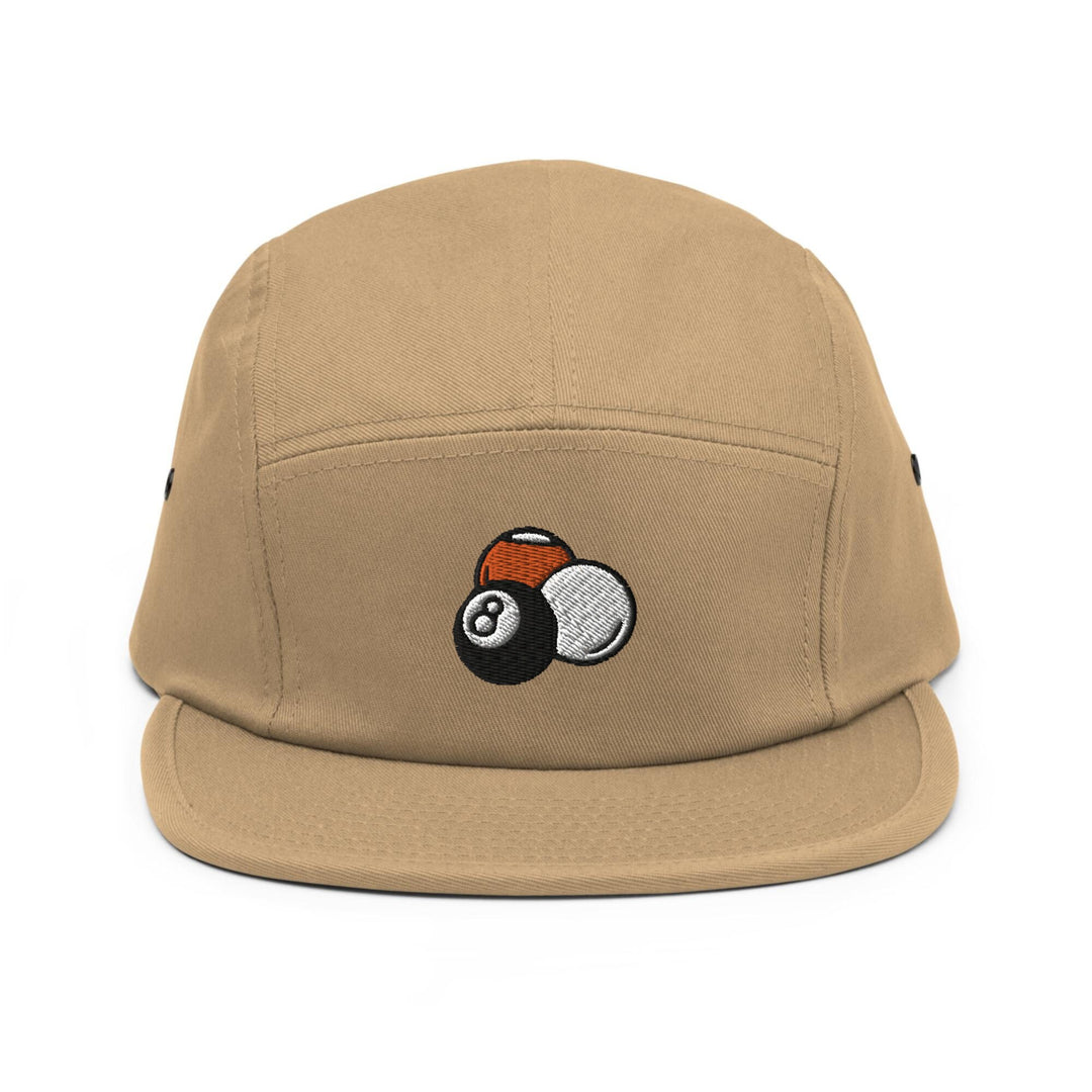 a tan hat with a pool ball embroidered on it