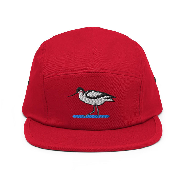 a red hat with a bird embroidered on it