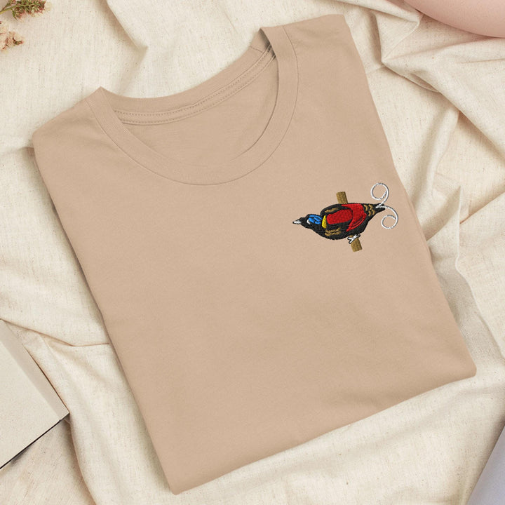 a t - shirt with a bird embroidered on it