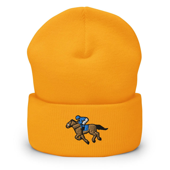 a yellow hat with a horse and jockey on it
