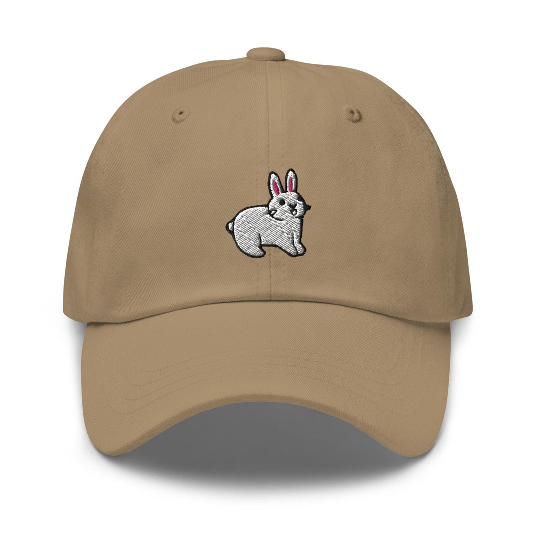a tan hat with a white rabbit embroidered on it
